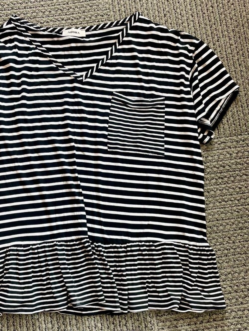 Super-soft black & white striped pocket t-shirt with ruffle bottom